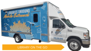 A brightly wrapped mobile library van features the “Libraries Unbound Mobile Outreach” design with illustrations of books, gears, and digital icons. The vehicle displays the Harrison County Library System branding and the message “Library on the Go.”